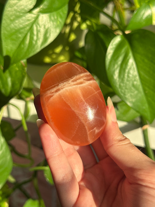 Juicy Orange Calcite Palm Stone A